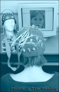 female with brain activity recording cap on.