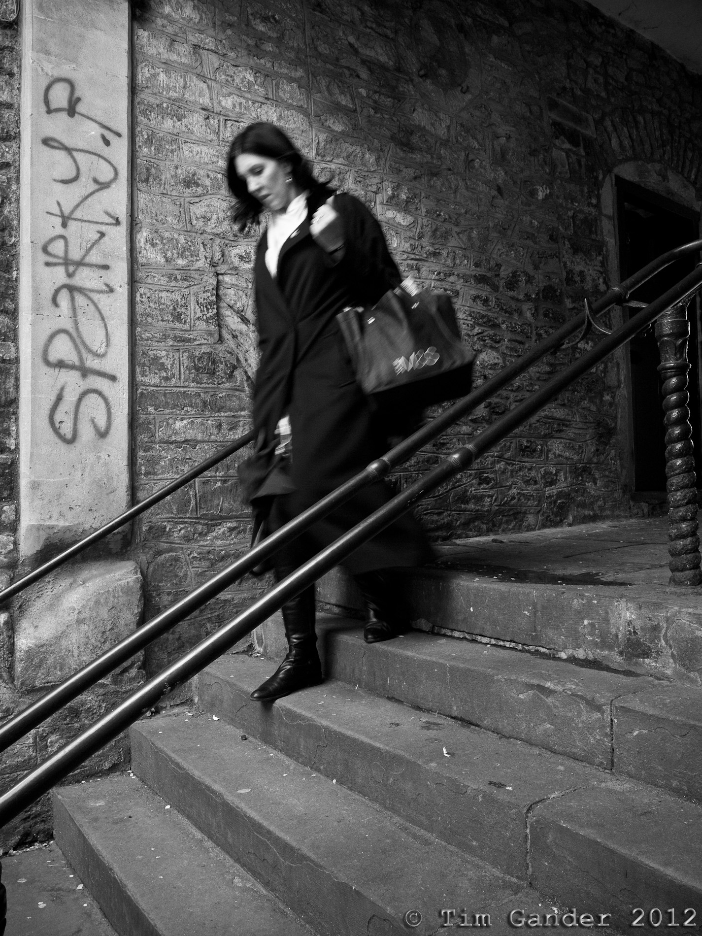 Woman on steps of Shepherds Barton, Frome