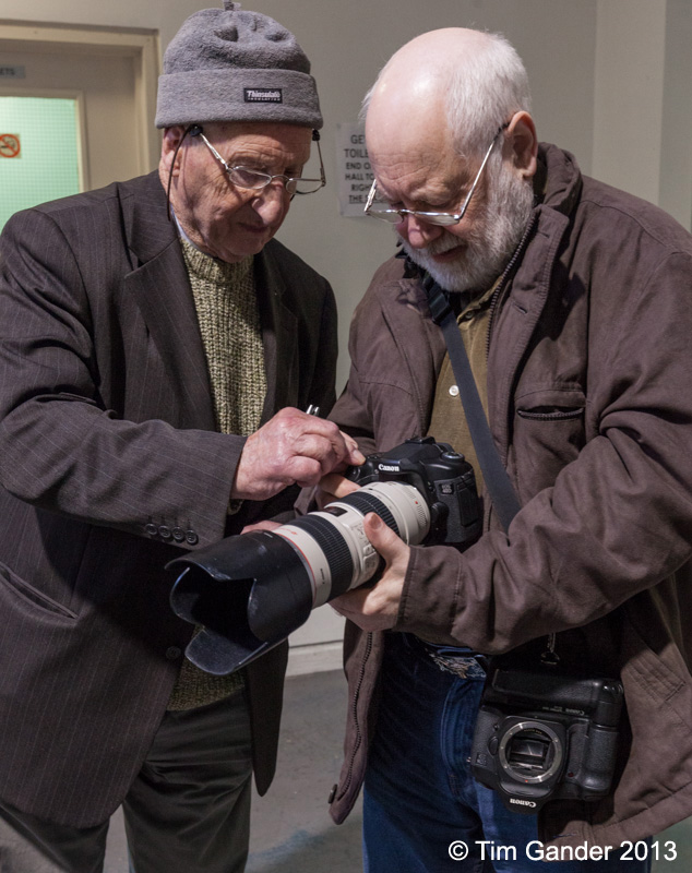 Brian Sawyer and Bill Collett try out a camera and lens