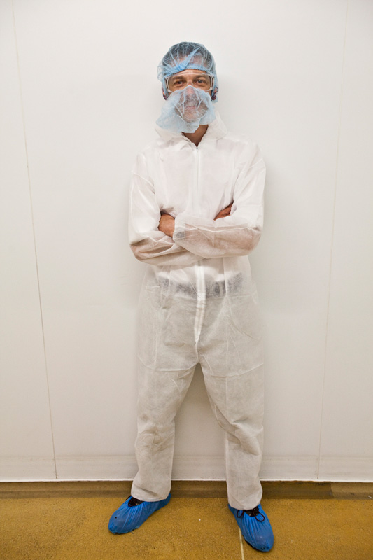 Tim Gander in full protective suit for hygiene purposes during a visit to Westbury Dairy