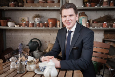 Alex Leese of Bath store Jolly's relaxes in his favourite cafe which features rustic artefacts in the decor.