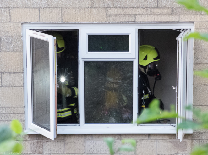 Firefighters work through the building to ensure there are no pockets of fire left