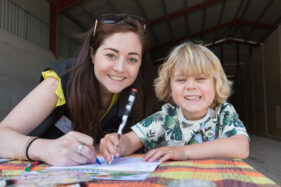 07/06/2015 Hosted at Meadowlea Farm in Compton Durville, Somerset, ABP Food Group staff get stuck in with Open Farm Sunday to help members of the public understand where their food comes from and how it's produced. Robyn Smyth of ABP helps young visitor Tom with a bit of colouring in. © Tim Gander 2015. All rights reserved.