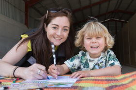 07/06/2015 Hosted at Meadowlea Farm in Compton Durville, Somerset, ABP Food Group staff get stuck in with Open Farm Sunday to help members of the public understand where their food comes from and how it's produced. Robyn Smyth of ABP helps young visitor Tom with a bit of colouring in. © Tim Gander 2015. All rights reserved.