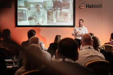 Motivational speaker Ollie Ollerton addresses a room of Hatmill colleagues.