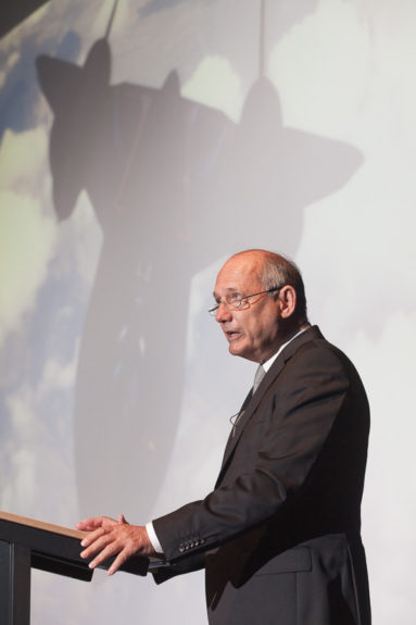 McLaren CEO Ron Dennis addresses a lecture audience at University of Bath