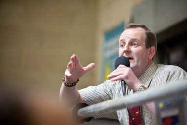 An auctioneer takes bids at Standerwick Livestock Market, Frome, UK.