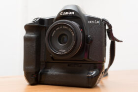 Canon EOS-1N with speed grip and 40mm f/2.8 pancake lens attached.