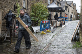 Carpenters and set builders at work in Frome's Gentle Street for the filming of Poldark.