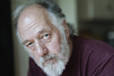 Moody close-up portrait of bearded man