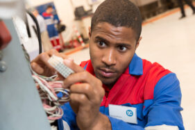 Checking the electrics on a test rig.