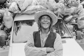 Bad Rasta travels the country selling merchandise at carnivals. Pictured here at Frome Carnival, Somerset, UK.