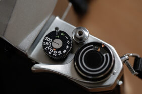 Detail showing the film advance lever, shutter speed dial and shutter release button.