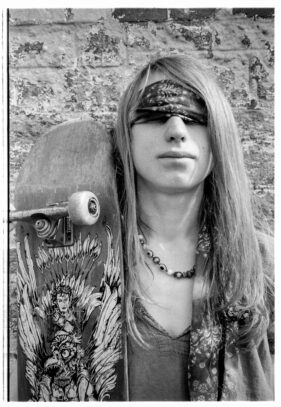 Danni Plausin poses with his skateboard outside the Cheese and Grain in Frome, Somerset, UK.