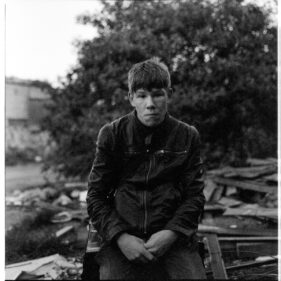 Dark, grainy portrait of a young man who visits the site to explore and make youtube videos.