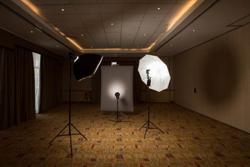 A portable photographic studio in a hotel ballroom.