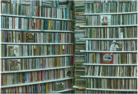 Two walls of CDs join at a floor to ceiling stack of more CDs.