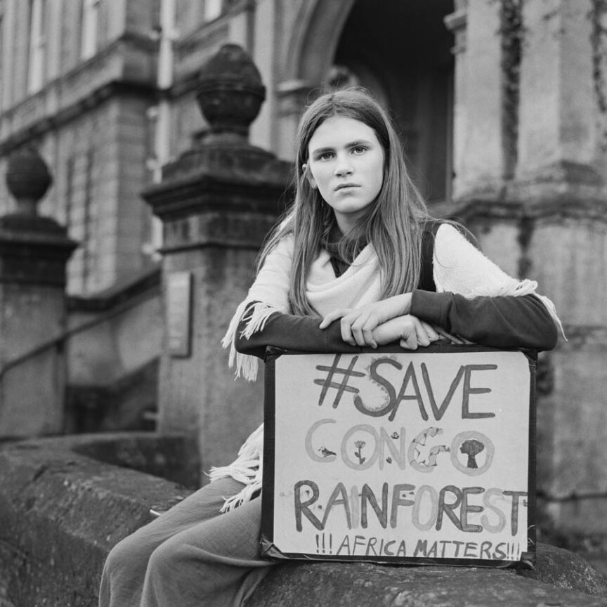 Portrait of Grace Maddrell (14) with placard which reads "#savecongorainforest Africa matters too!"