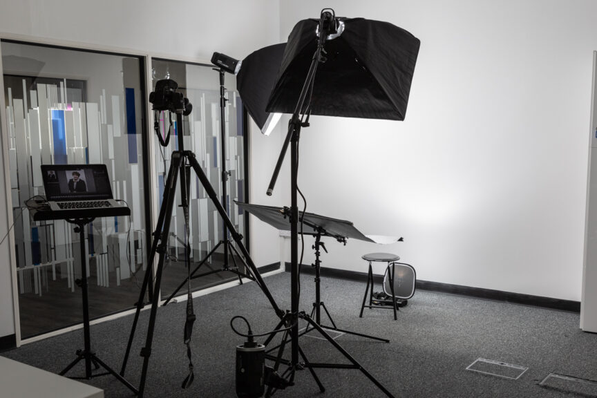 Business portrait mobile studio flash equipment set up in an office space.