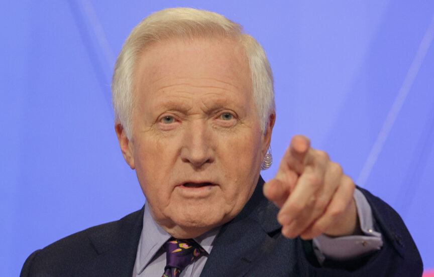 Former Question Time presenter David Dimbleby points to take a question from an audience member during a recording of the programme at University of Bath