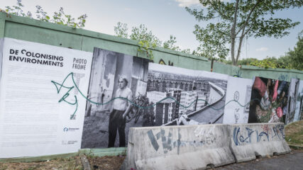 A section of the poster installation showing the graffiti the day after we finished.