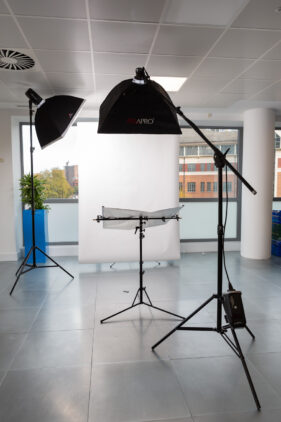 Two studio heads used for a portrait set-up in an empty area of office space.